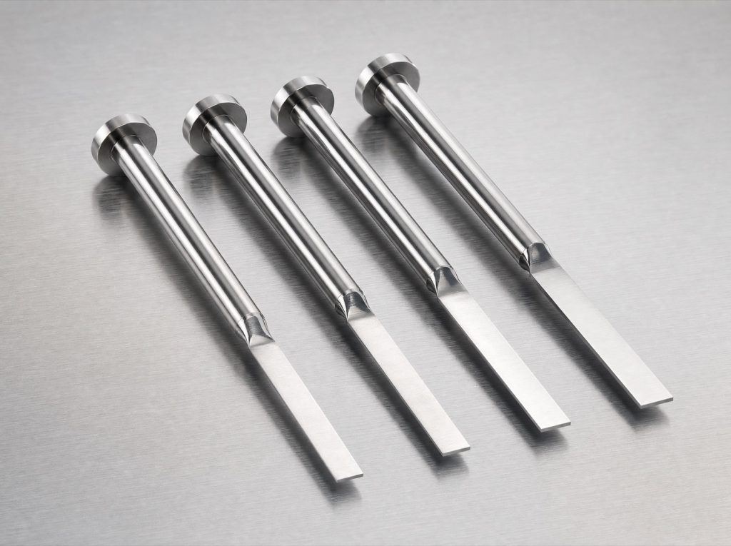 Blade ejector pins on brushed steel